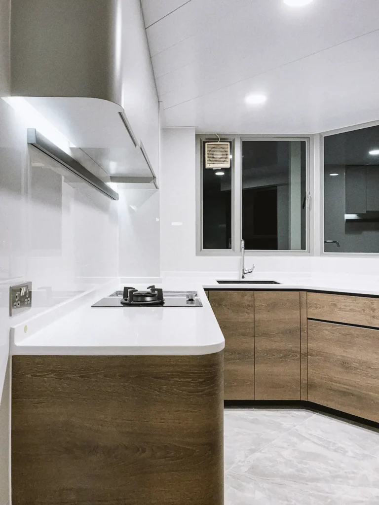 Caribbean Coast kitchen design with white corian top and walnut cabinet