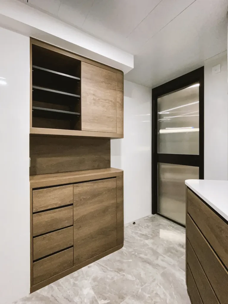 Caribbean Coast kitchen design with white corian top and walnut cabinet