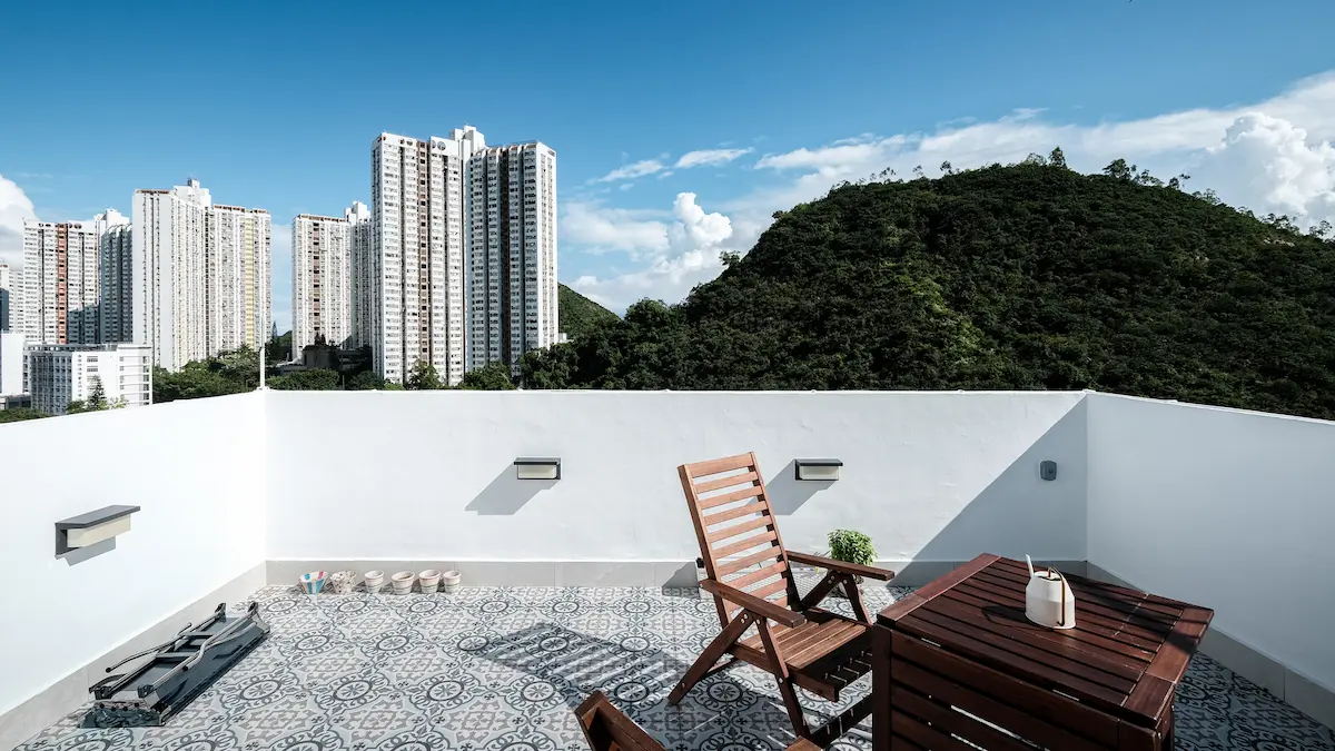 Beautiful sky view with Spanish tiles, white wall, and roof