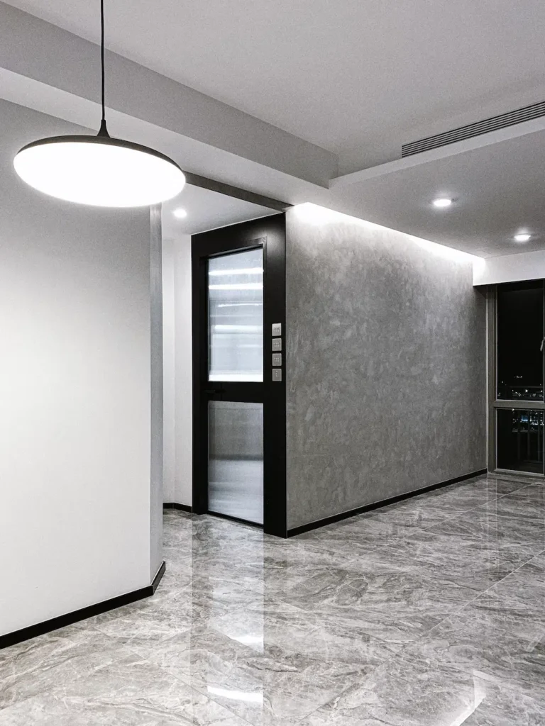 Caribbean Coast interior design with grey concrete wall and marble floor