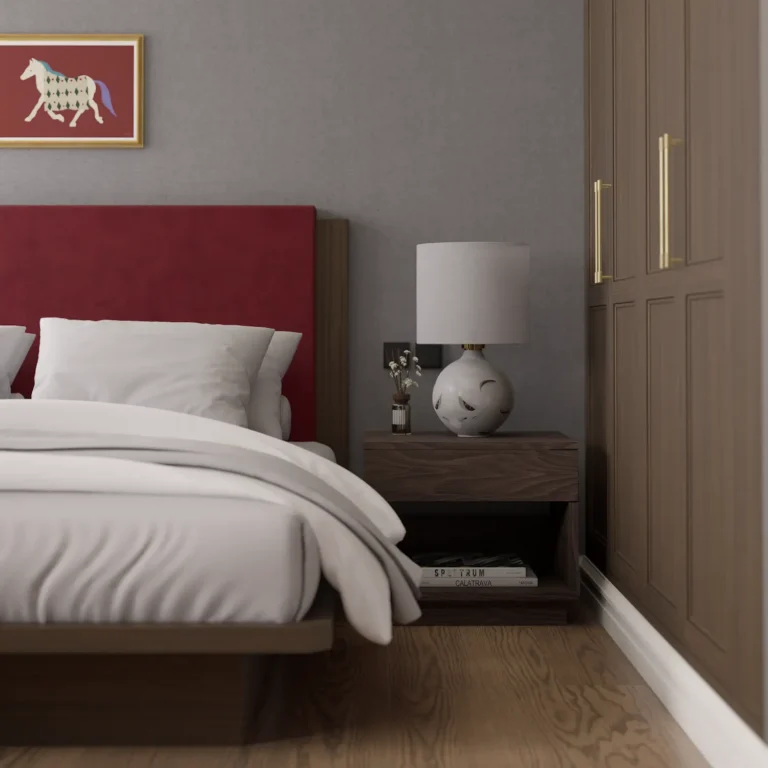 Modern heritage bedroom interior design featuring a bold red velvet headboard, dark wood nightstand, white table lamp, and built-in wardrobe.