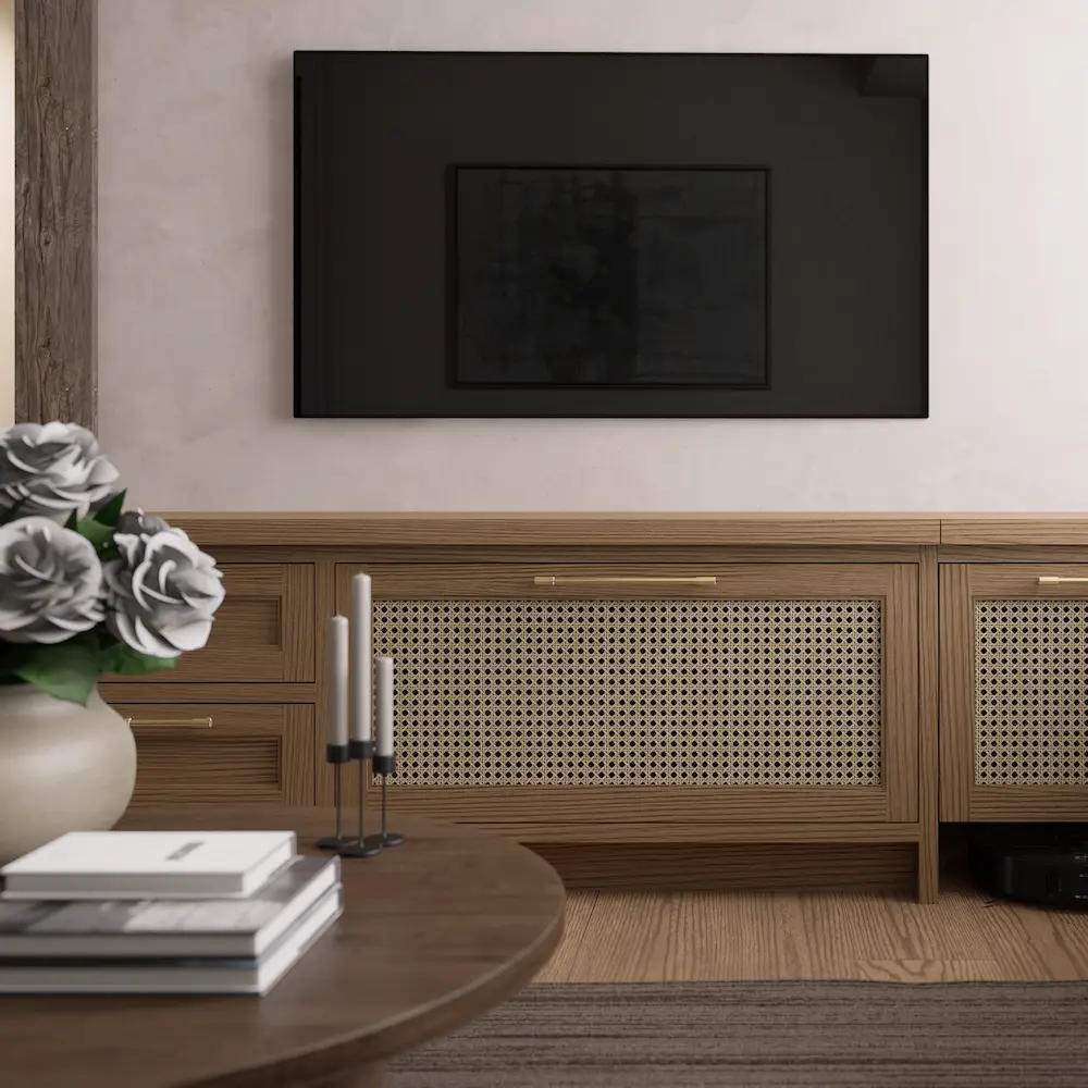 Japandi style living room with a wall-mounted TV, natural cane webbing media console, and coffee table decor.